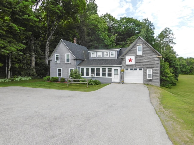 170 Main St, Sangerville, ME 04479 - traditional-style home with driveway, roof with shingles, a front lawn, and a chimney