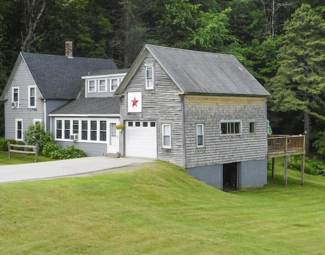 170 Main St, Sangerville, ME 04479 - view of front facade with a shingled roof, a front yard, concrete driveway, and a wooden deck