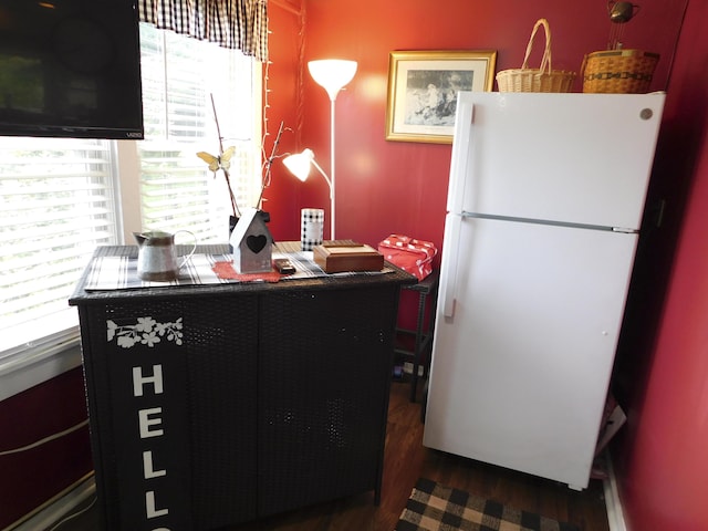 170 Main St, Sangerville, ME 04479 - kitchen with freestanding refrigerator, wood finished floors, and a desk