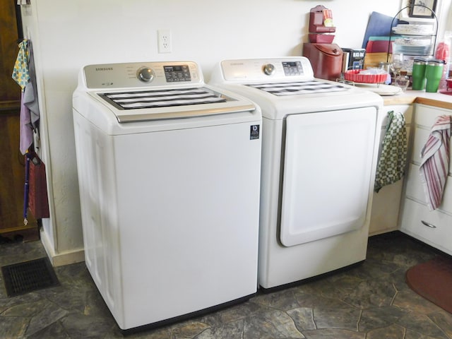 170 Main St, Sangerville, ME 04479 - laundry room featuring washer and clothes dryer and stone finish flooring