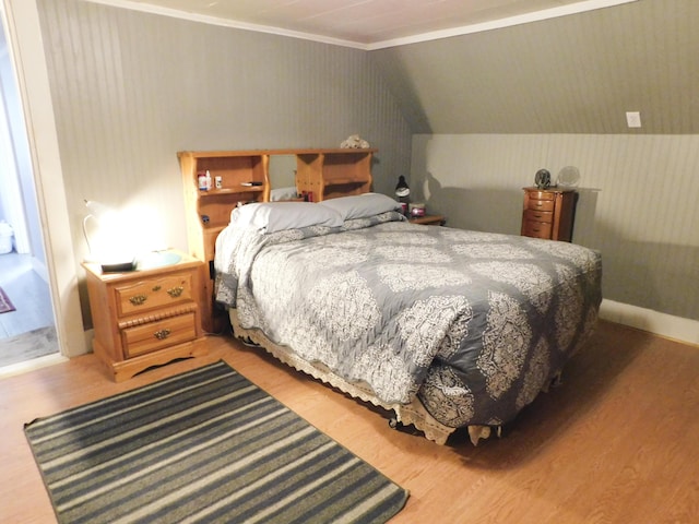 170 Main St, Sangerville, ME 04479 - bedroom with wood finished floors, ornamental molding, and lofted ceiling