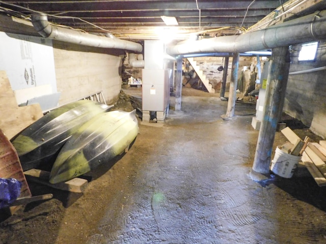 170 Main St, Sangerville, ME 04479 - unfinished basement featuring stairway and heating unit