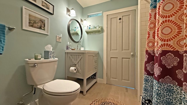 25 Church St, Lubec, ME 04652 - bathroom featuring wood finished floors, vanity, and curtained shower