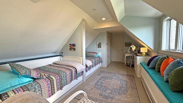 25 Church St, Lubec, ME 04652 - bedroom featuring wood finished floors, vaulted ceiling, and recessed lighting