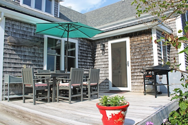 25 Church St, Lubec, ME 04652 - wooden terrace with outdoor dining area