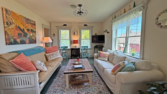 25 Church St, Lubec, ME 04652 - living area with wood finished floors and a chandelier