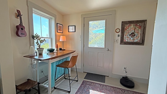 25 Church St, Lubec, ME 04652 - entrance foyer with light tile patterned floors and baseboards