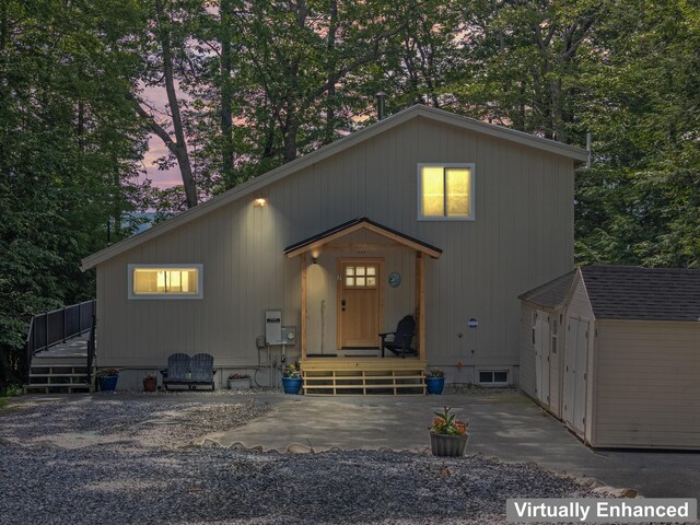 7 Papoose Island Rd, Raymond, ME 04071 - view of front facade with a shed and a deck