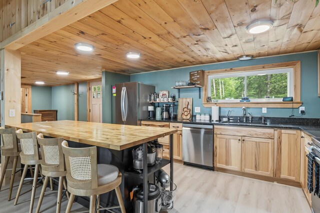 7 Papoose Island Rd, Raymond, ME 04071 - kitchen with stainless steel appliances, butcher block counters, open shelves, wood ceiling, and light wood-style floors