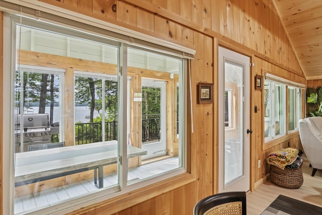 7 Papoose Island Rd, Raymond, ME 04071 - doorway featuring lofted ceiling and wood walls