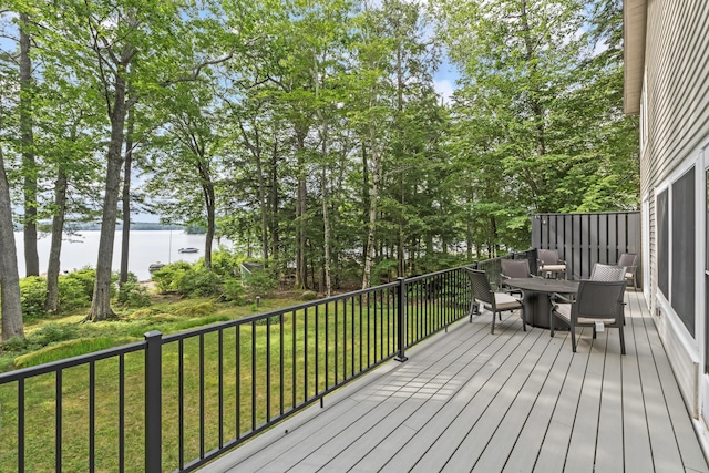 7 Papoose Island Rd, Raymond, ME 04071 - wooden terrace featuring a water view, outdoor dining area, and a yard