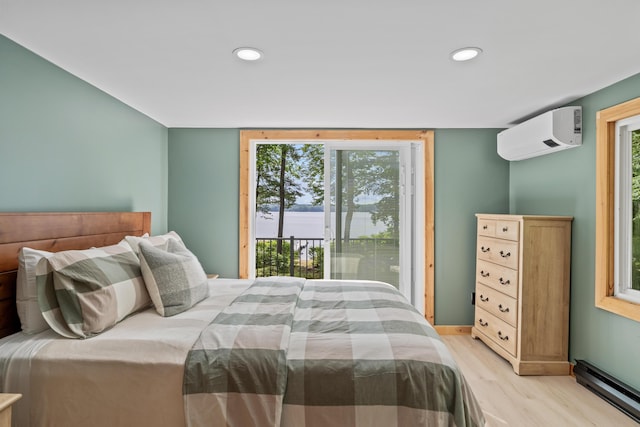 7 Papoose Island Rd, Raymond, ME 04071 - bedroom featuring access to outside, an AC wall unit, baseboard heating, multiple windows, and recessed lighting
