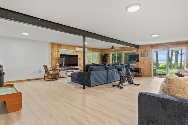 7 Papoose Island Rd, Raymond, ME 04071 - living area featuring wood walls, light wood-type flooring, beam ceiling, and ceiling fan