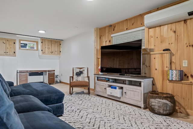 7 Papoose Island Rd, Raymond, ME 04071 - living room featuring an AC wall unit and wood finished floors