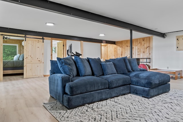 7 Papoose Island Rd, Raymond, ME 04071 - living room with wood finished floors, beamed ceiling, a baseboard heating unit, and healthy amount of natural light