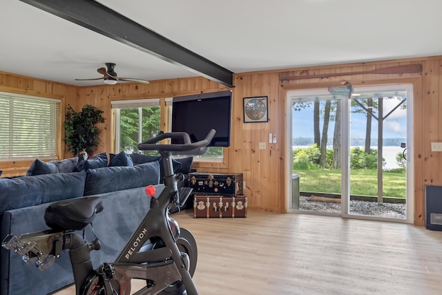 7 Papoose Island Rd, Raymond, ME 04071 - living area with wood walls, a ceiling fan, beamed ceiling, and wood finished floors