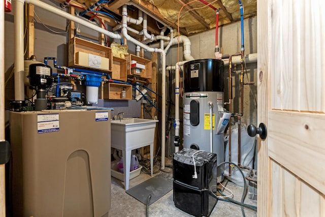 7 Papoose Island Rd, Raymond, ME 04071 - utility room featuring water heater and heat pump water heater