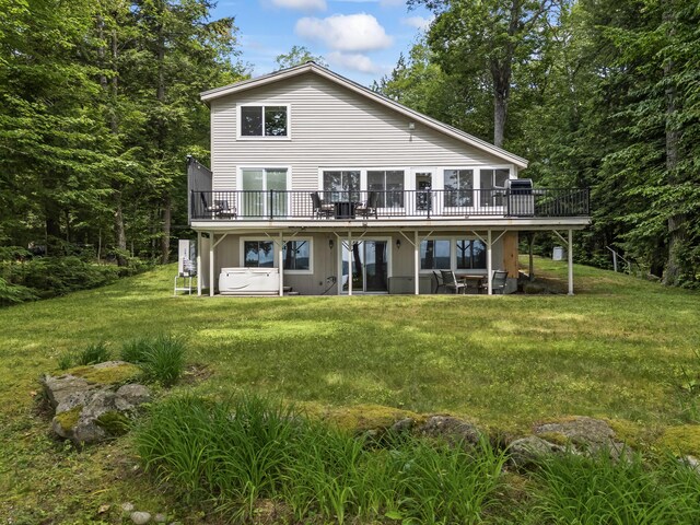 7 Papoose Island Rd, Raymond, ME 04071 - rear view of house featuring a wooden deck and a yard