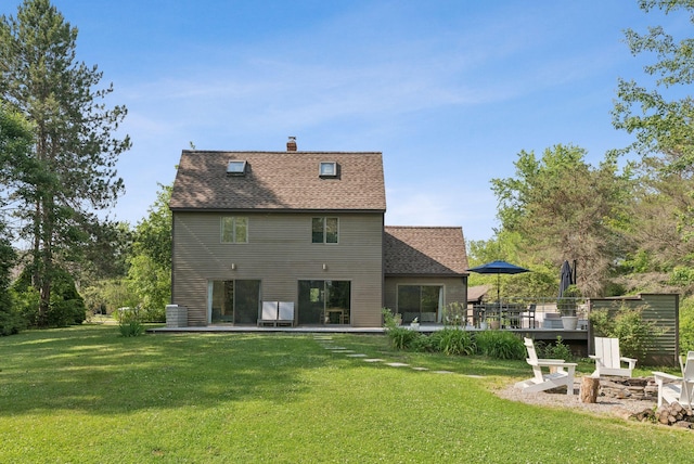 2 Far View Cir, Saco, ME 04072 - rear view of property with a yard, a fire pit, a deck, roof with shingles, and a chimney