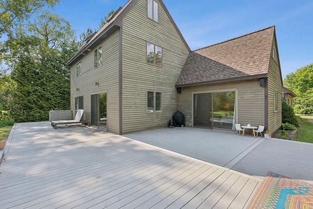 2 Far View Cir, Saco, ME 04072 - back of property with a wooden deck and roof with shingles