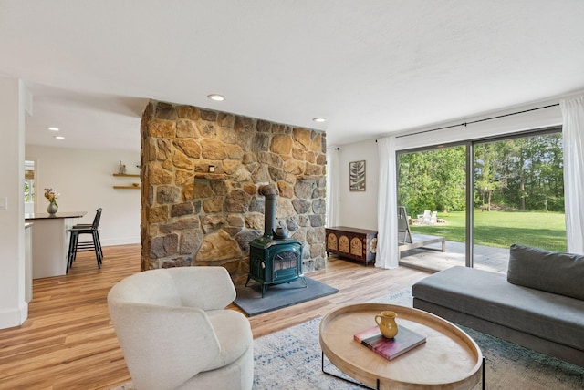 2 Far View Cir, Saco, ME 04072 - living room featuring a wood stove, light wood-type flooring, and recessed lighting