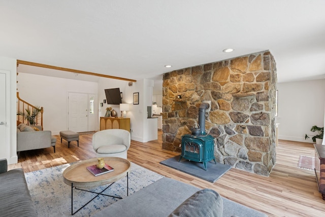 2 Far View Cir, Saco, ME 04072 - living area featuring a wood stove, light wood-style floors, and stairs