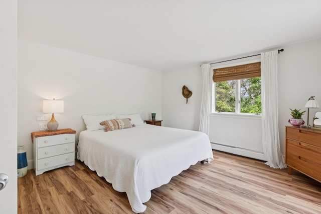 2 Far View Cir, Saco, ME 04072 - bedroom with a baseboard heating unit and light wood-type flooring