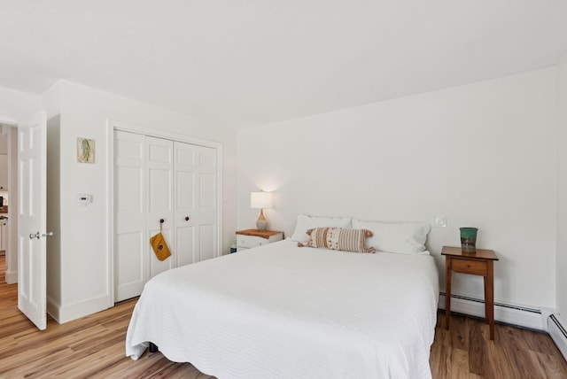 2 Far View Cir, Saco, ME 04072 - bedroom with light wood-style flooring, a closet, and a baseboard radiator