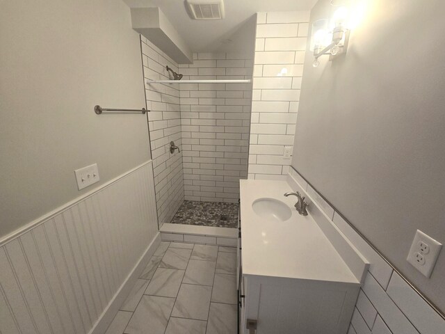 106 Cumberland Ave Unit 201, Portland, ME 04101 - full bath featuring a tile shower, vanity, and marble finish floors
