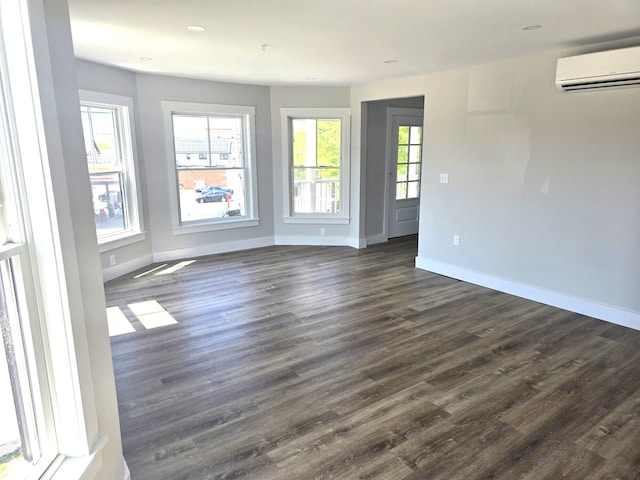106 Cumberland Ave Unit 201, Portland, ME 04101 - unfurnished room featuring a wall unit AC, dark wood-style floors, and recessed lighting