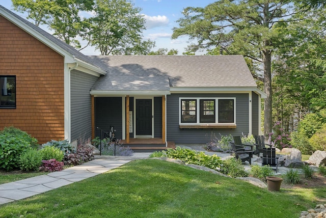 7 Coven Hill Ln, South Bristol, ME 04568 - view of front of home with a front lawn and a shingled roof