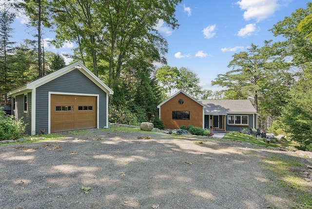 7 Coven Hill Ln, South Bristol, ME 04568 - view of front facade featuring a detached garage and an outdoor structure
