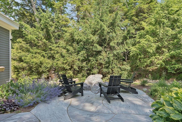 7 Coven Hill Ln, South Bristol, ME 04568 - view of patio featuring a forest view