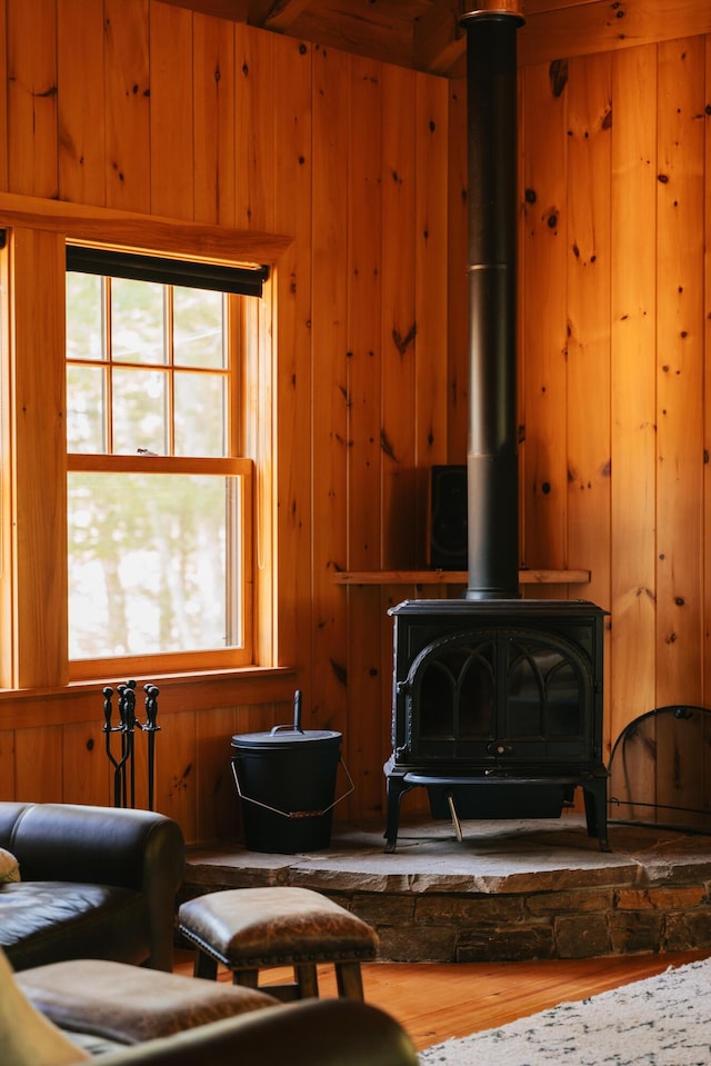 7 Coven Hill Ln, South Bristol, ME 04568 - living area featuring a wood stove, wood finished floors, and wooden walls