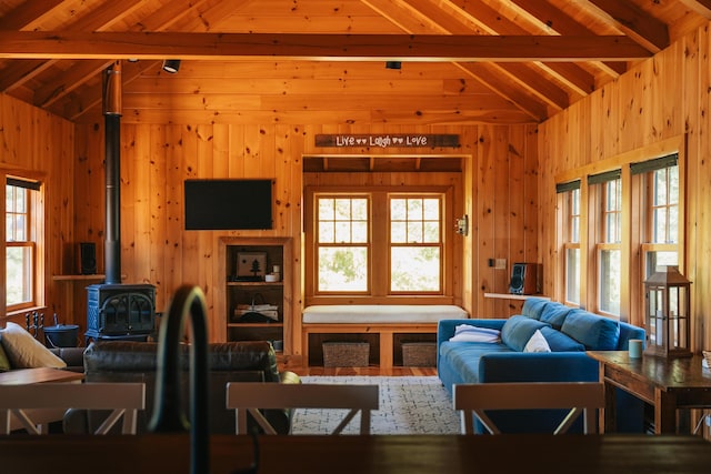 7 Coven Hill Ln, South Bristol, ME 04568 - living area with wooden walls, a wood stove, and healthy amount of natural light