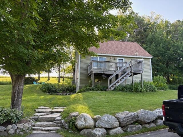 232 Hatch Rd, Prospect, ME 04981 - rear view of property featuring a deck, a yard, and stairs