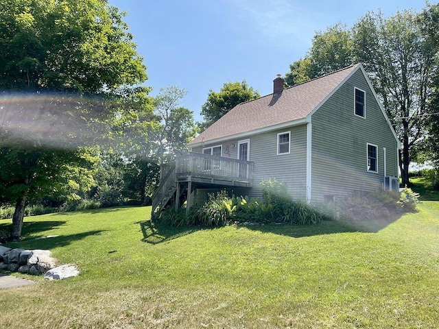 232 Hatch Rd, Prospect, ME 04981 - view of side of property with a wooden deck, a chimney, a yard, stairs, and roof with shingles