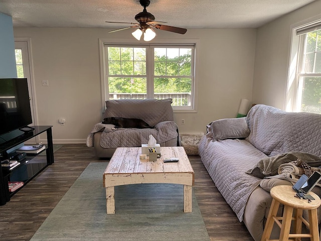232 Hatch Rd, Prospect, ME 04981 - living area featuring ceiling fan, a textured ceiling, and dark wood-style flooring