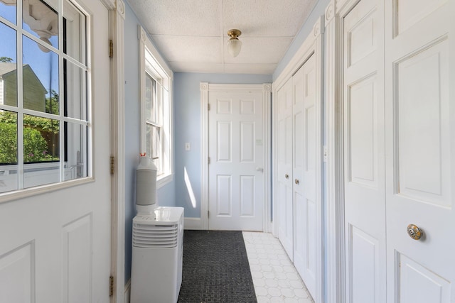 390 Front St, Bath, ME 04530 - hallway with healthy amount of natural light, light floors, and a paneled ceiling