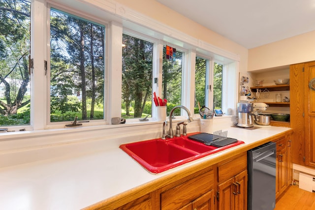 390 Front St, Bath, ME 04530 - kitchen featuring dishwashing machine, light countertops, brown cabinetry, and open shelves