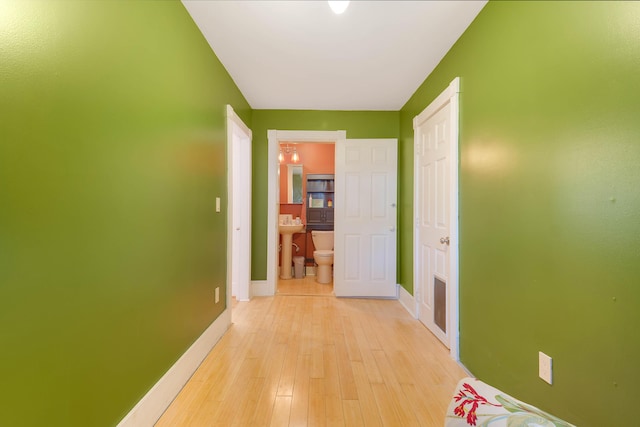 390 Front St, Bath, ME 04530 - hallway featuring baseboards and light wood-style flooring