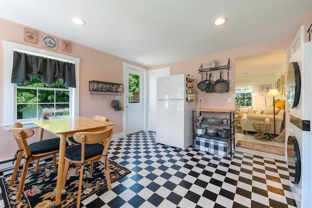 390 Front St, Bath, ME 04530 - dining area with stacked washing machine and dryer, tile patterned floors, and recessed lighting