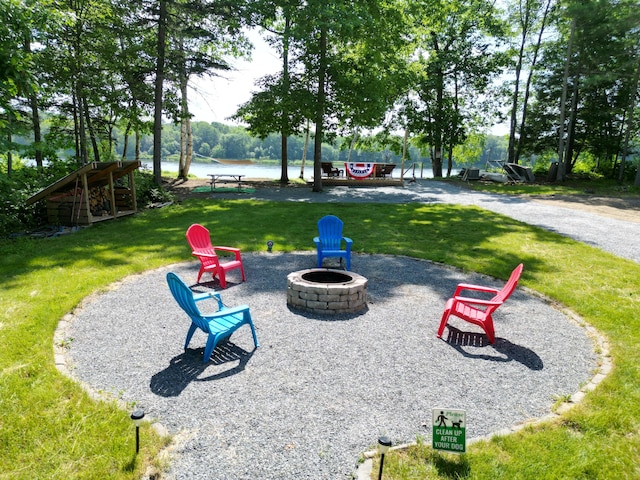 1093 N Chester Rd, Chester, ME 04457 - view of home's community featuring an outdoor fire pit, a yard, and a water view