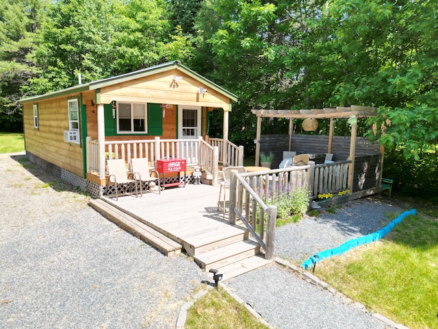 1093 N Chester Rd, Chester, ME 04457 - view of front of property with a pergola, cooling unit, a porch, and a deck