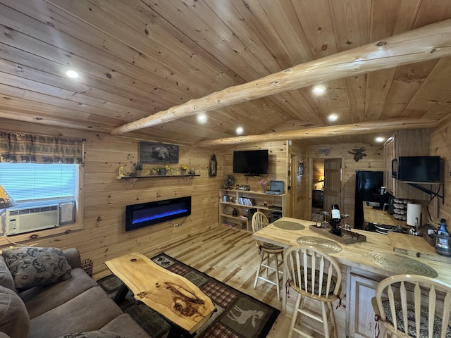 1093 N Chester Rd, Chester, ME 04457 - living room with wooden walls, wood finished floors, recessed lighting, a wooden ceiling with exposed beams, and a glass covered fireplace