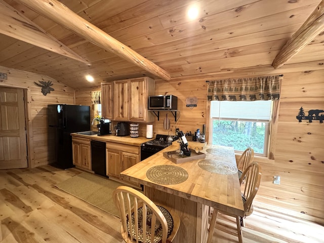 1093 N Chester Rd, Chester, ME 04457 - kitchen with black appliances, wooden ceiling, light wood-style flooring, wooden walls, and plenty of natural light
