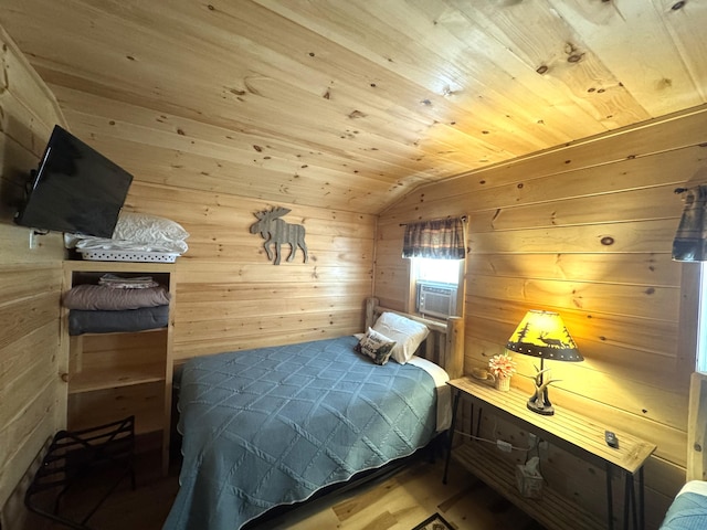 1093 N Chester Rd, Chester, ME 04457 - bedroom featuring wood walls, lofted ceiling, cooling unit, and wood ceiling