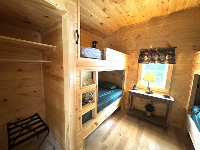1093 N Chester Rd, Chester, ME 04457 - bedroom featuring wooden walls, wood ceiling, wood finished floors, and lofted ceiling