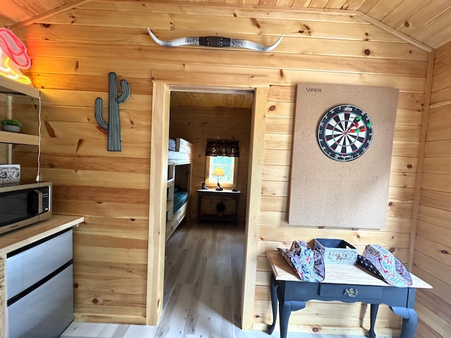 1093 N Chester Rd, Chester, ME 04457 - hallway with wooden walls, wood finished floors, wooden ceiling, and vaulted ceiling