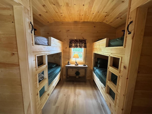 1093 N Chester Rd, Chester, ME 04457 - bedroom with vaulted ceiling, wood walls, light wood-style floors, and wooden ceiling